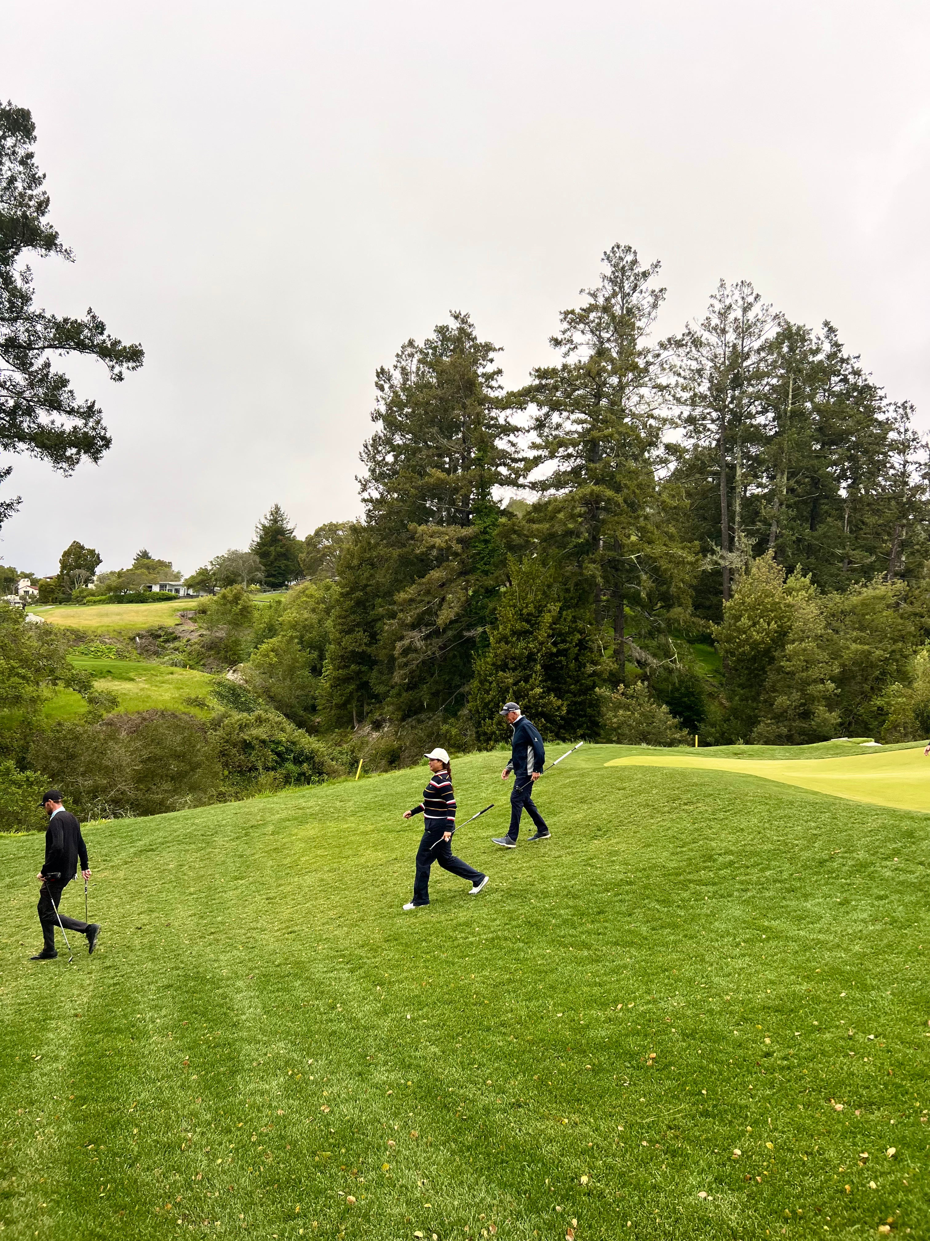 Golfers walking down the greens at Pasatiempo Golf Course in Santa Cruz, CA