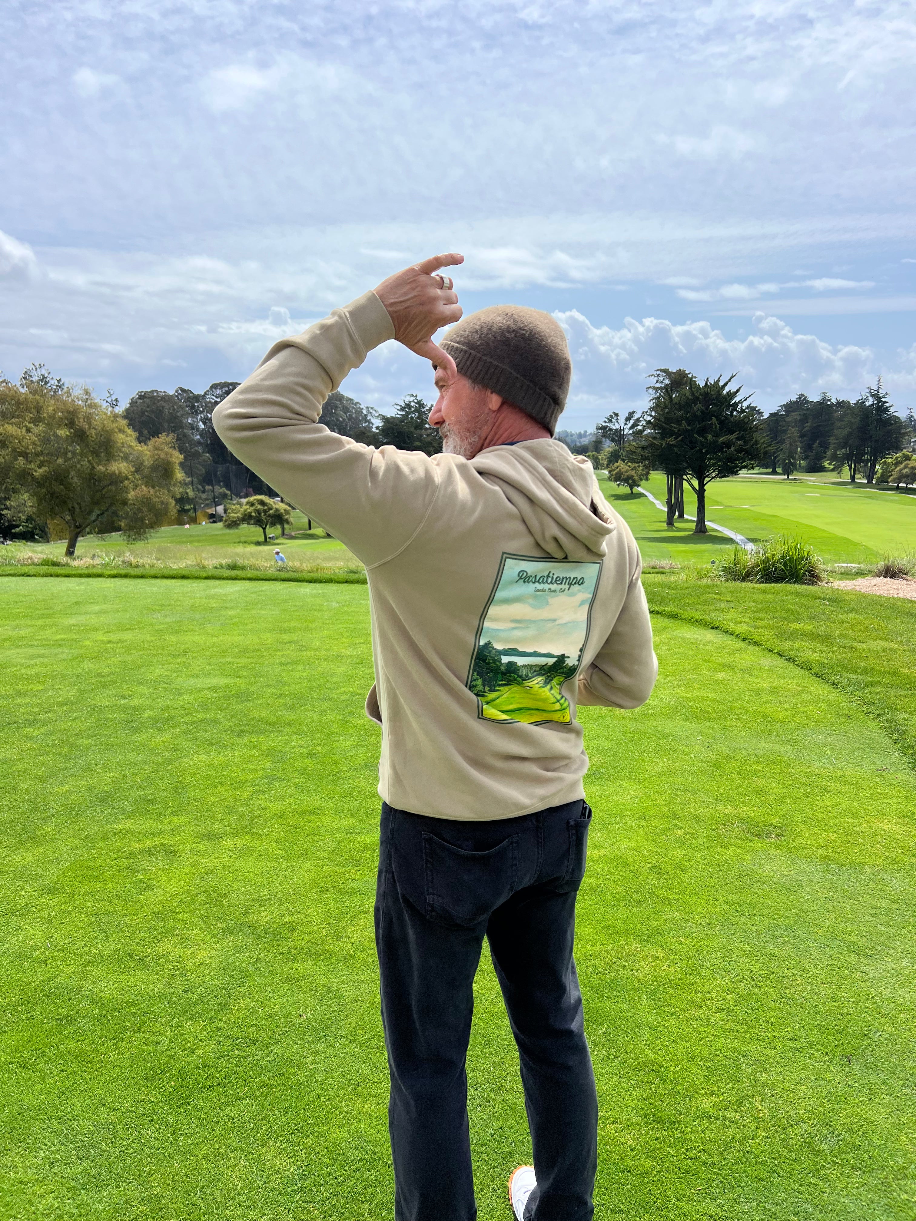 Man wearing the Ashworth Brother's Hoodie with artwork of the Pasatiempo Golf Course