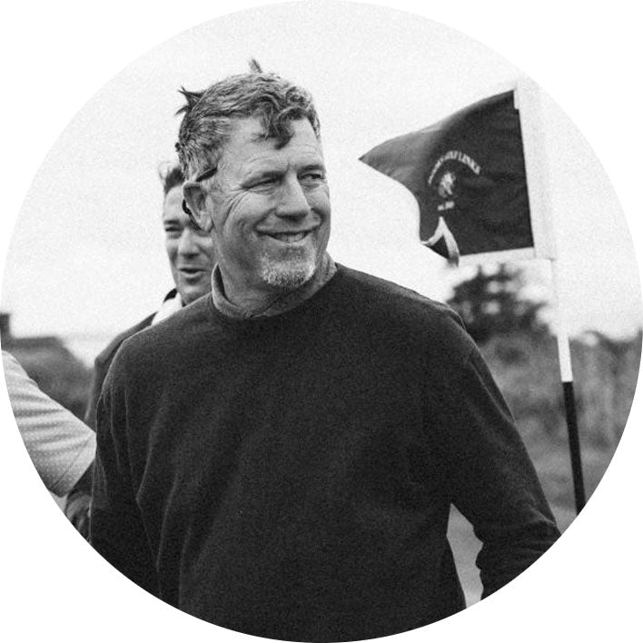 Black and white photo of a Hank Ashwirth with a golf stick flag in the background