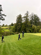 Golfers walking down the greens at Pasatiempo Golf Course in Santa Cruz, CA