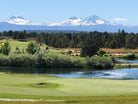 Pronghorn golf course with a lake and mountains in the background